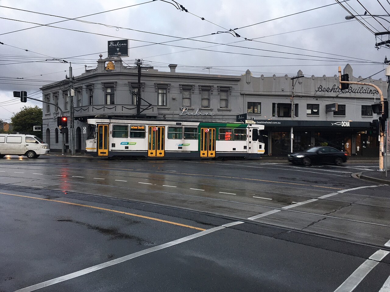 A-class tram on route 48 at a wet intersection