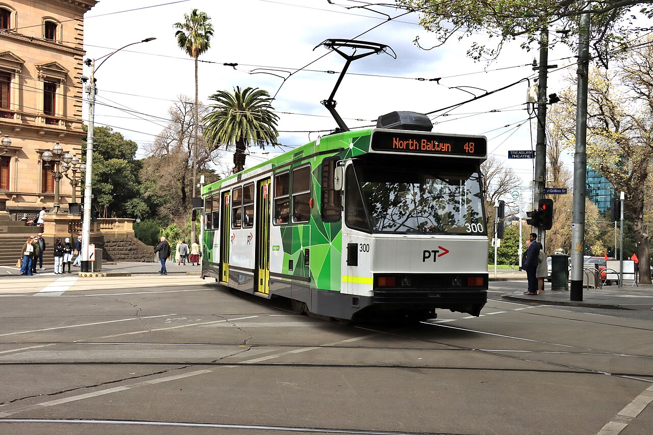 A-class tram 300 among palm trees