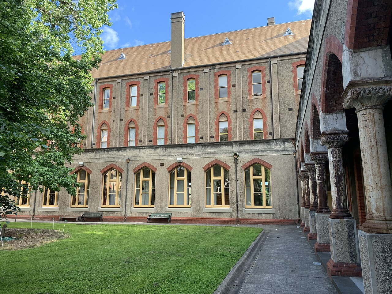 Abbotsford Convent main building with arched cloister and lawn