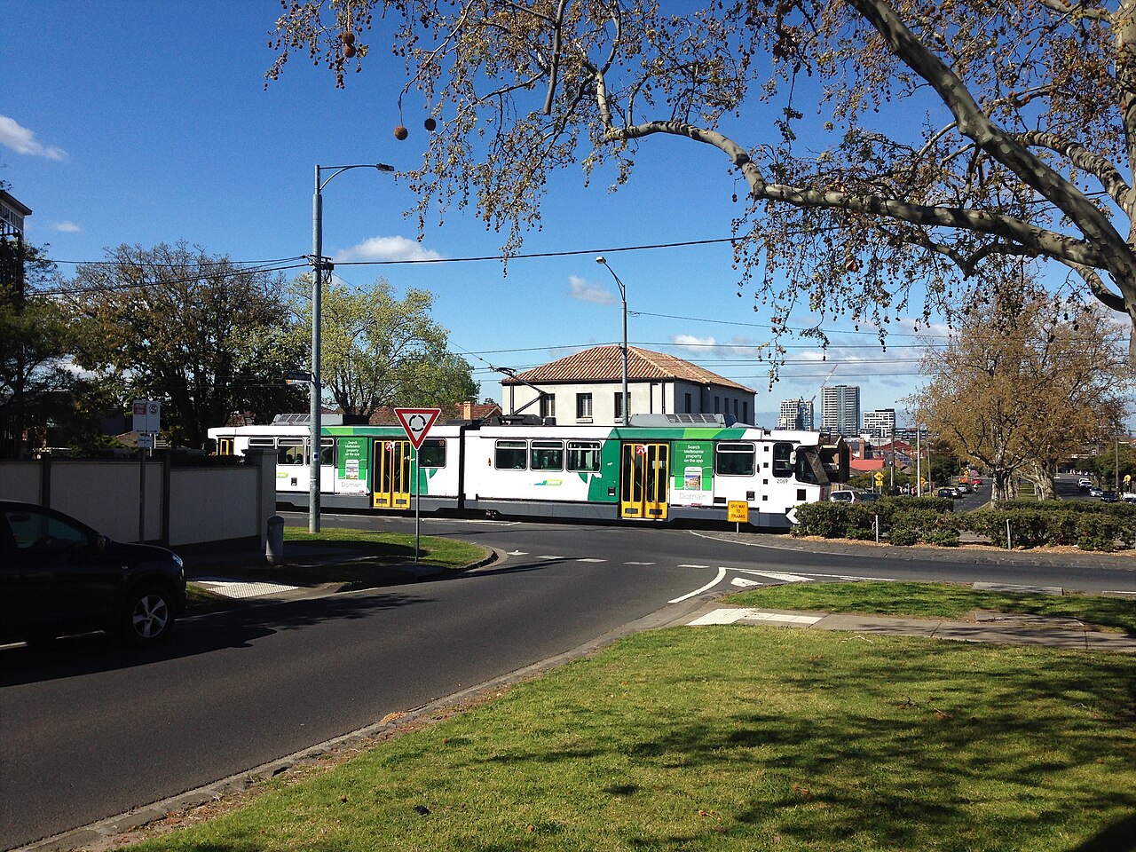 Route 59 tram passing a grassy reserve