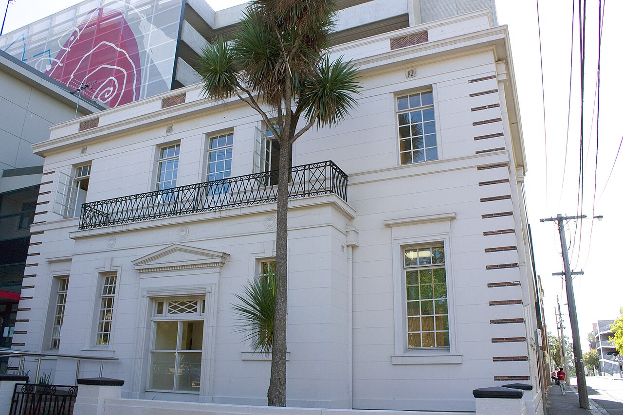 White building on the corner of Napier Street and Victoria Parade