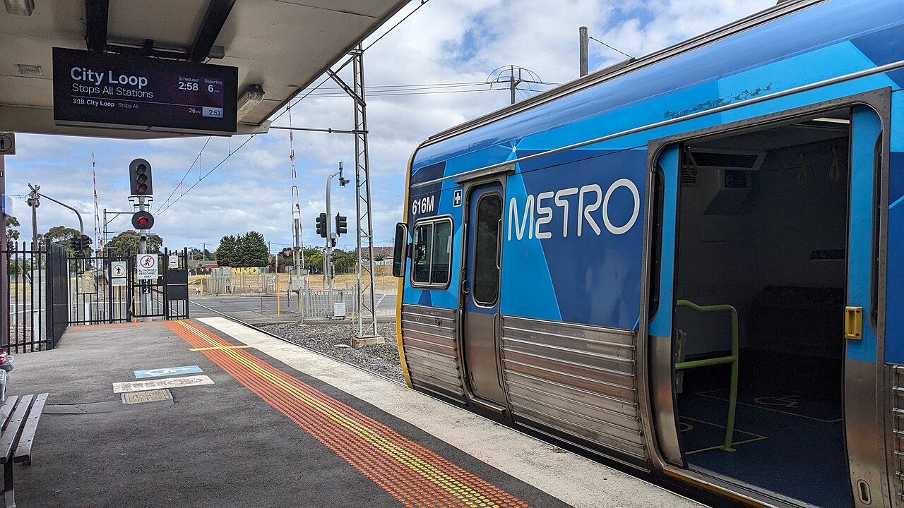 Metro train waiting at the platform at Upfield Station