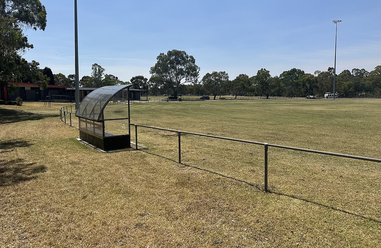 Grassy oval with a dugout at CT Barling Reserve