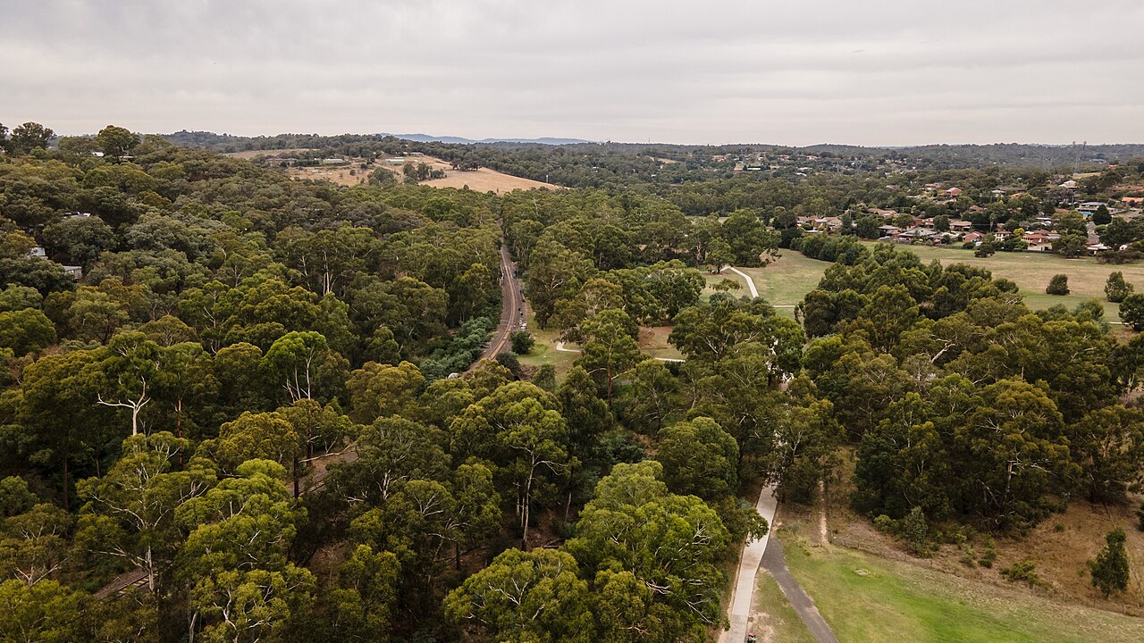 Aerial view of the Diamond Creek Trail beside the Hurstbridge line