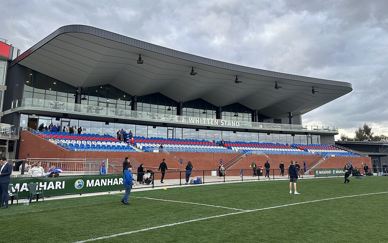 The EJ Whitten Stand grandstand beside a football oval