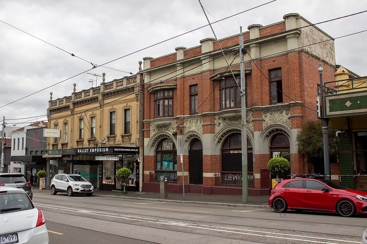 Ornate red-brick former State Savings Bank building on a street corner