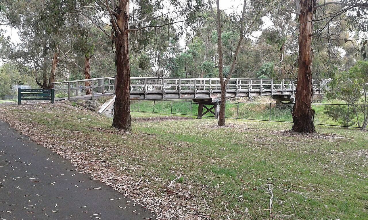 Gardiners Creek footbridge among trees, Burwood