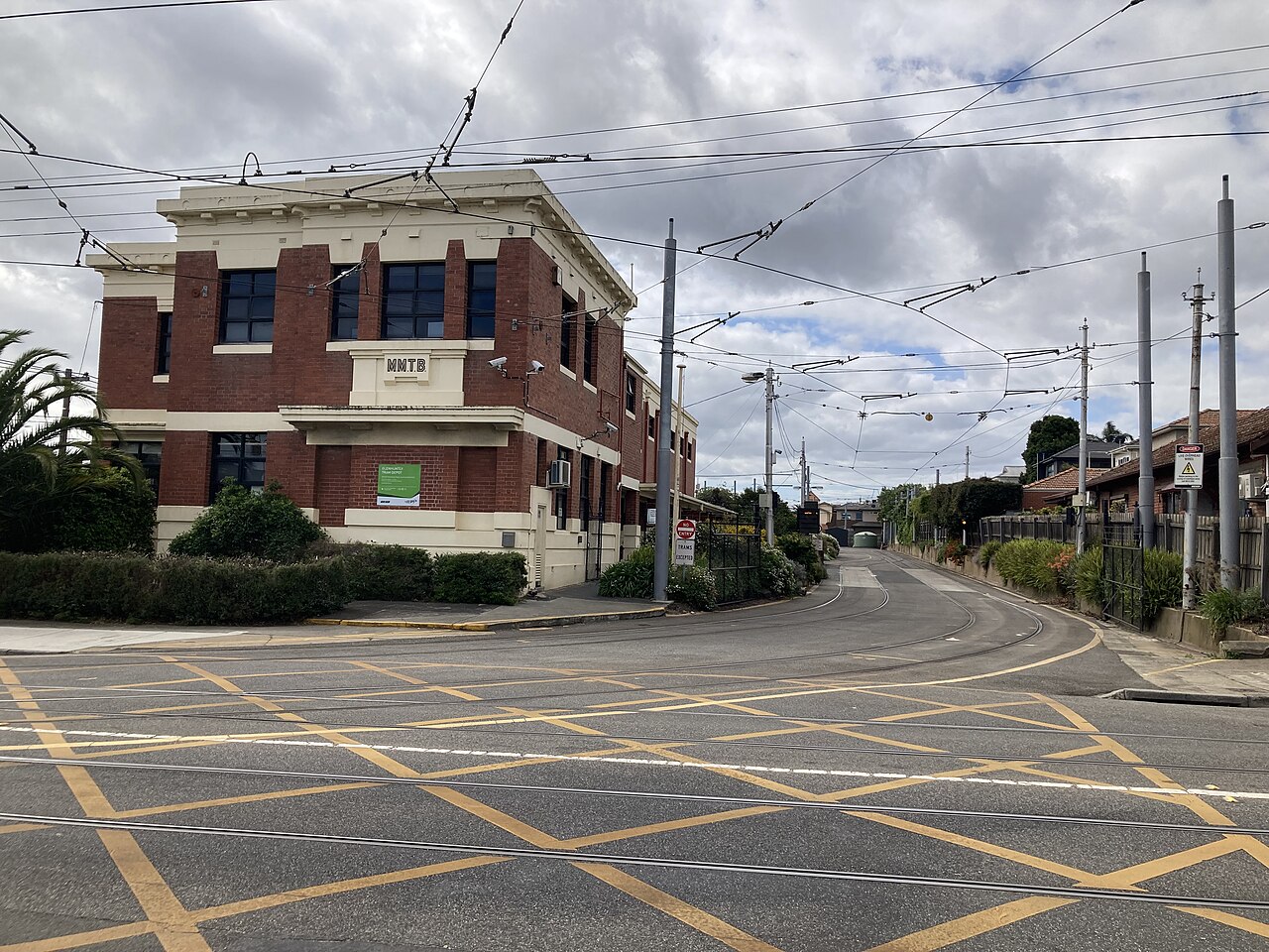 Brick Glenhuntly Tram Depot building at a quiet intersection