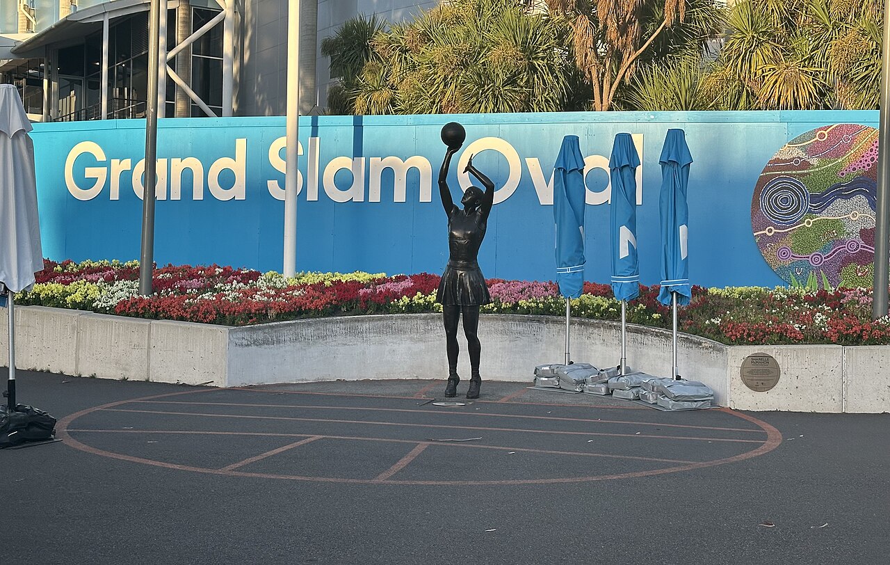 Grand Slam Oval sign and statue