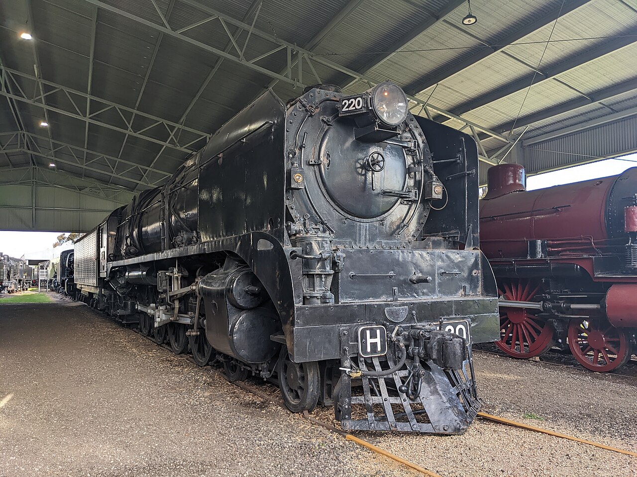 Black steam locomotive H220 on display at the Newport Railway Museum