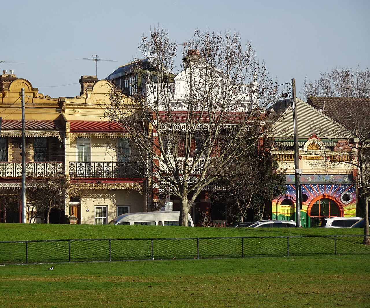 Row of Victorian terrace houses facing a park