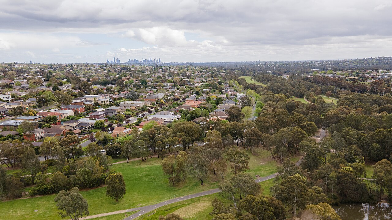 Looking towards the Melbourne CBD skyline over leafy suburbs