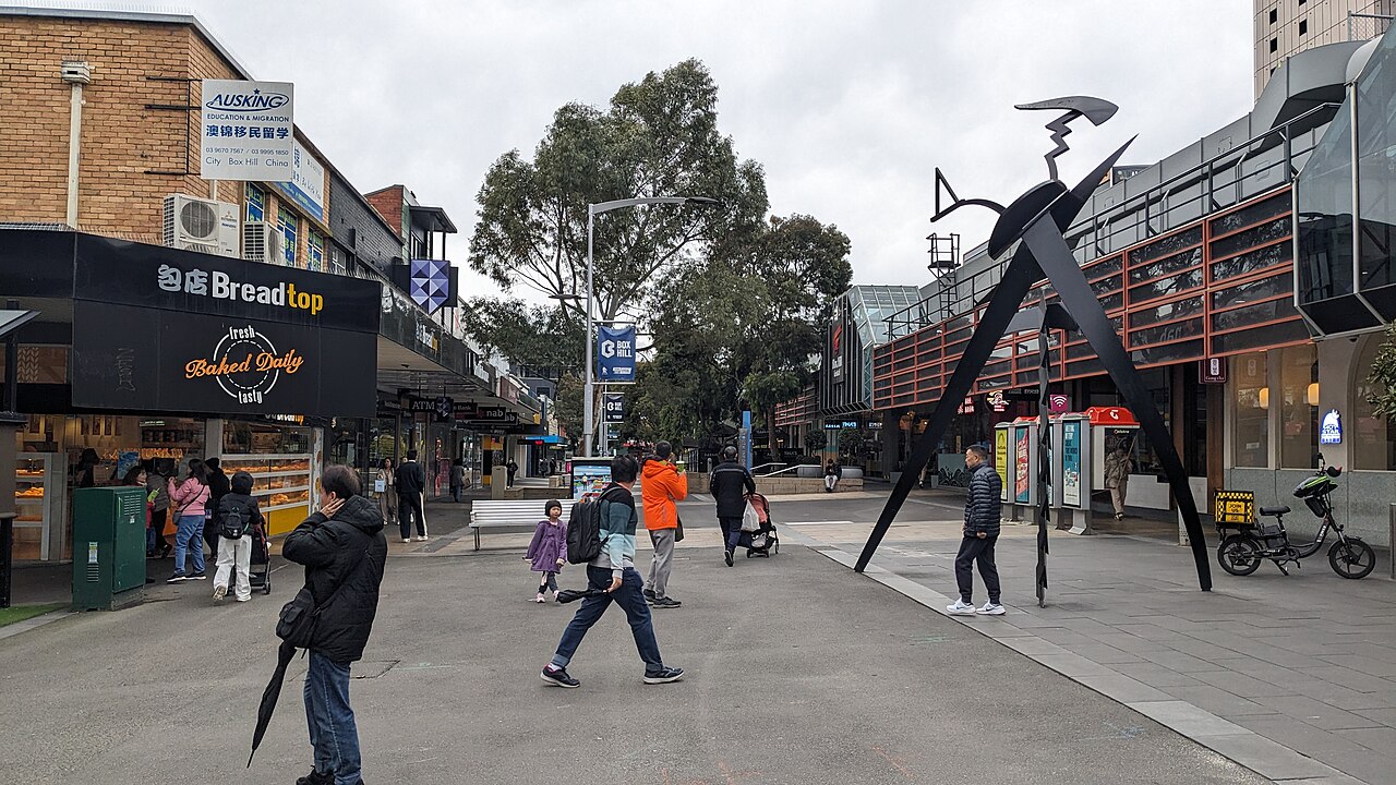 Main Street looking east in Box Hill with a public sculpture