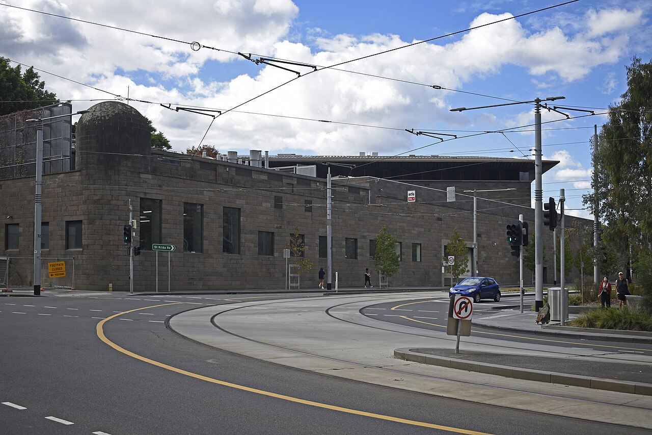 The National Gallery of Victoria building beside a tram-wired intersection