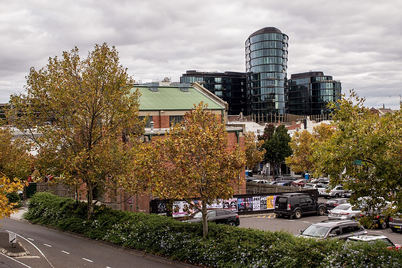 MMTB substation behind autumn trees and a carpark