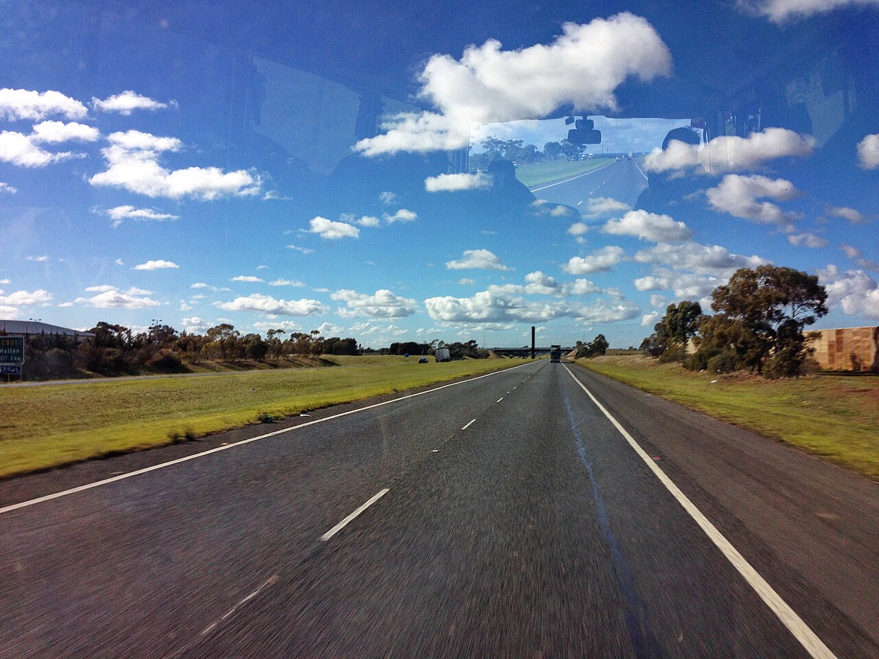 Highway through open paddocks near Brookfield
