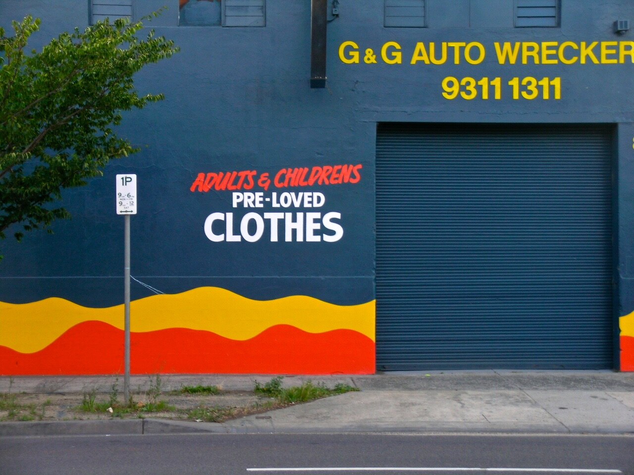 Op shop with a bright painted wall in Sunshine