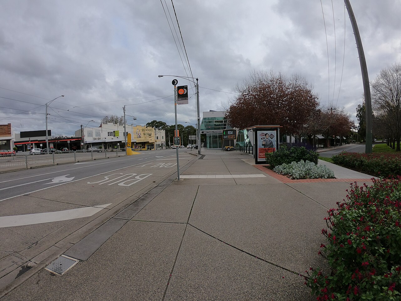 Outer Circle Trail at Harp Junction with shops beyond