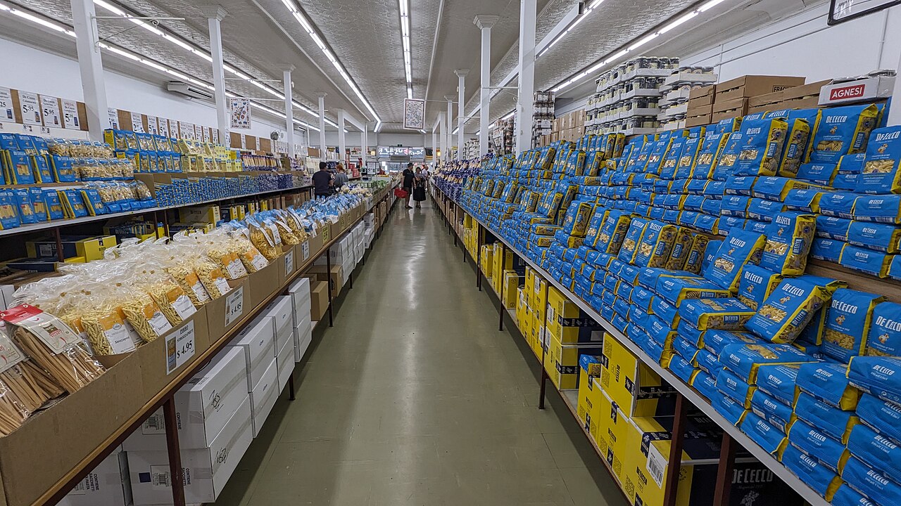 Long pasta aisles inside a wholesale grocery