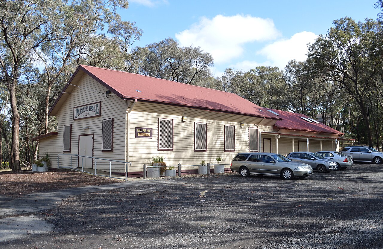 Weatherboard Plenty Hall with a red roof