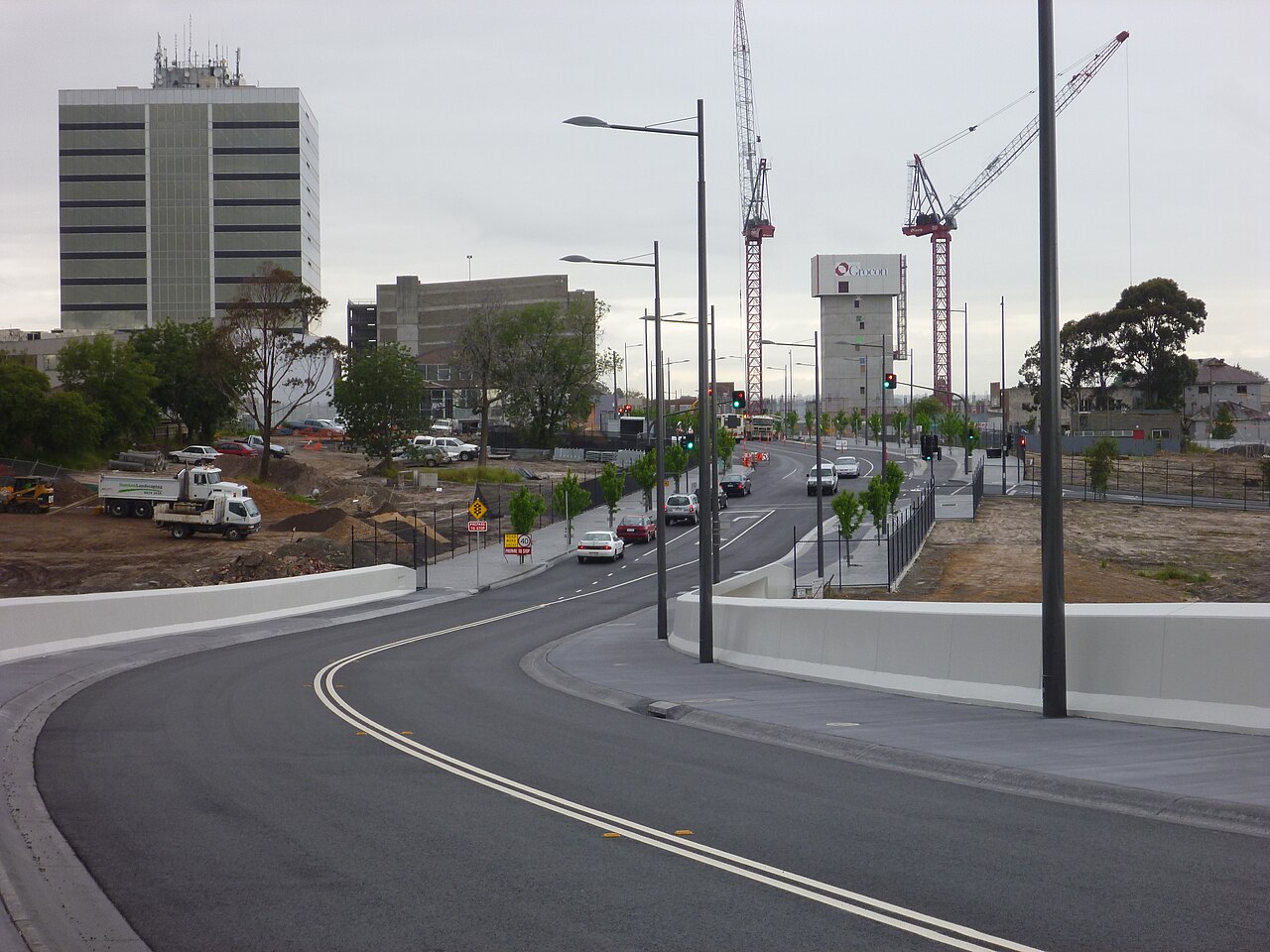 View of Dandenong from a new bridge, with cranes