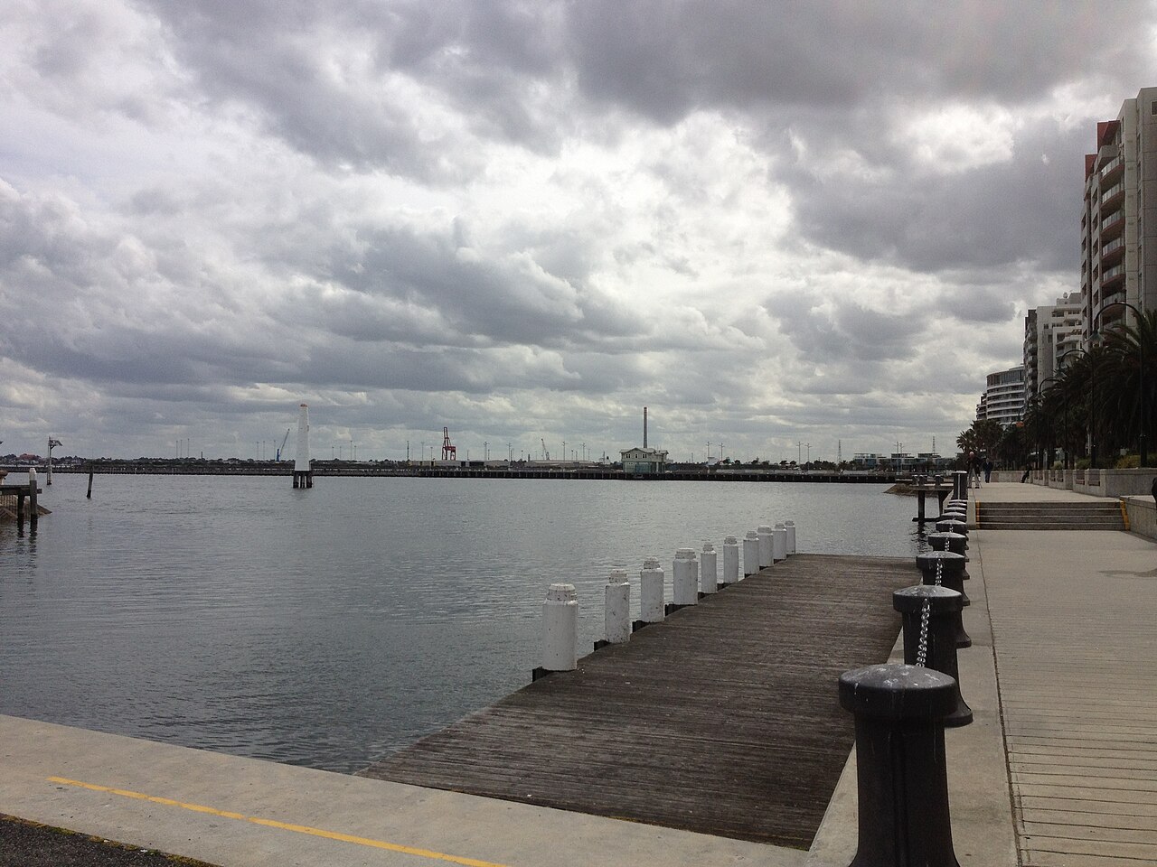 Pier and bay under a cloudy sky at Port Melbourne