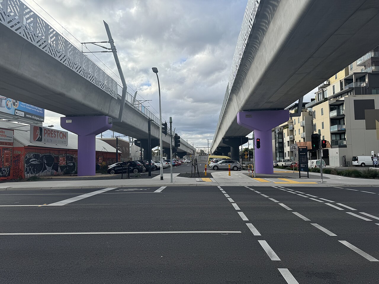 Signalised pedestrian crossing beside the elevated railway at Preston railway station
