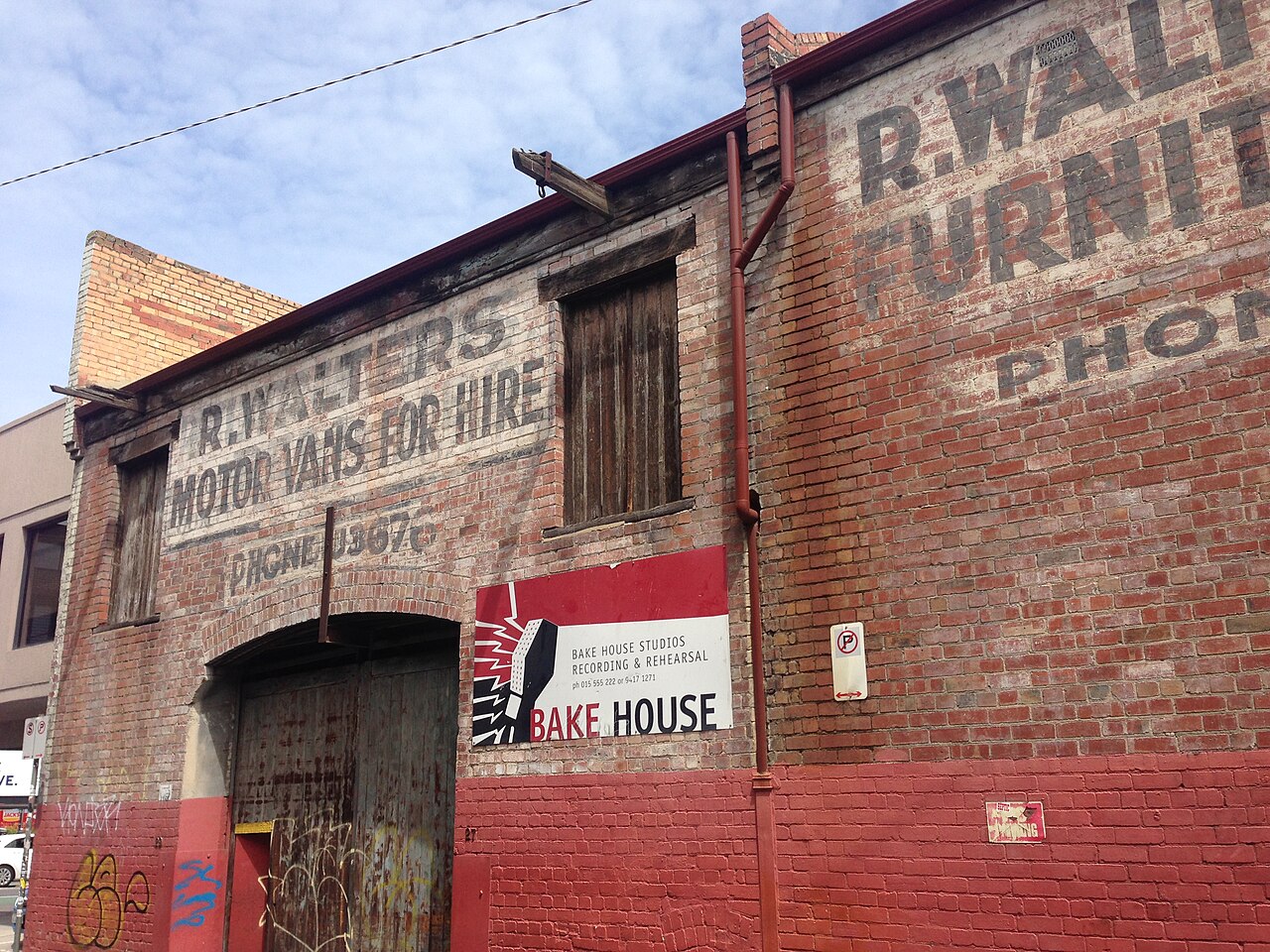 R. Walters ghost sign on an old brick warehouse