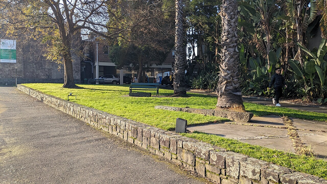 Raoul Wallenberg Garden with lawn and palms