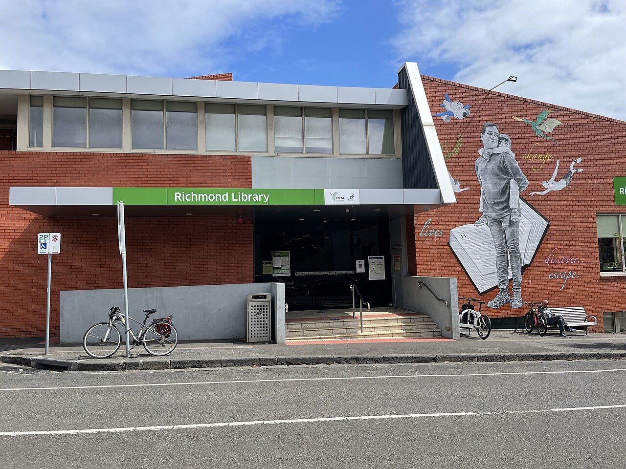 Richmond Library building with a mural on its brick wall