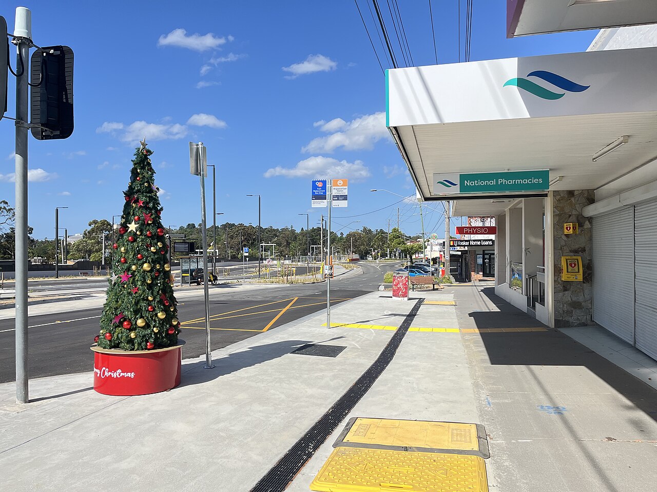 Shops on the main street of Ringwood East with a Christmas tree