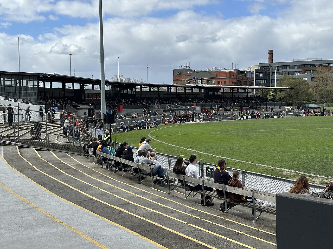 Spectators on the terraces beside the Victoria Park oval