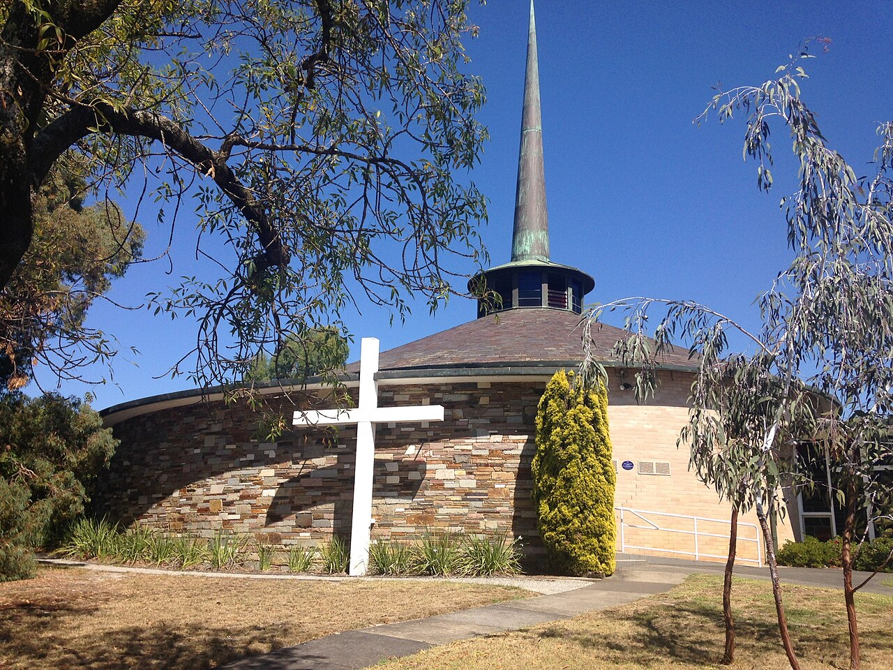 St Faiths Anglican Church exterior with spire and cross