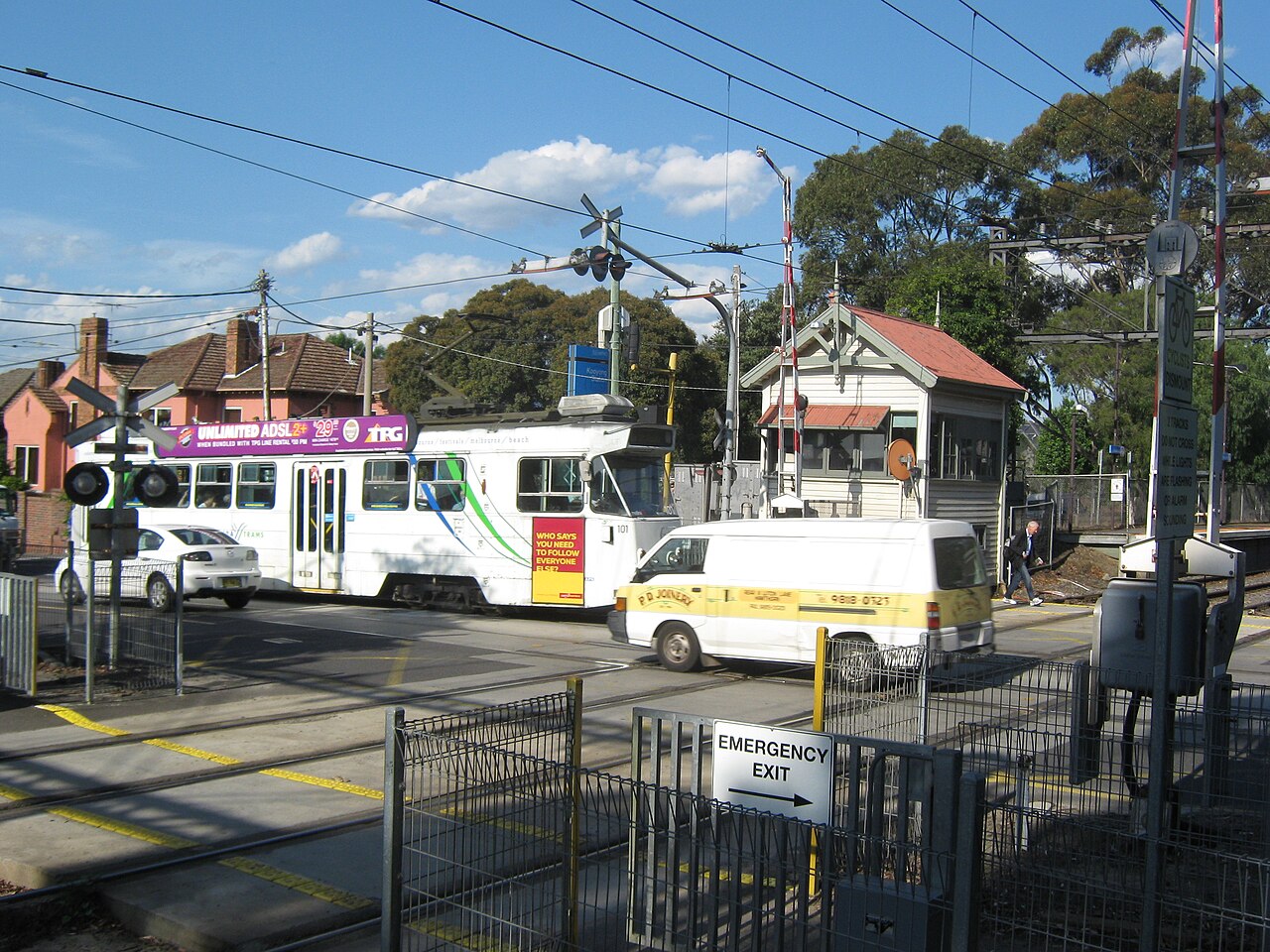 Tram approaching the Kooyong station level crossing