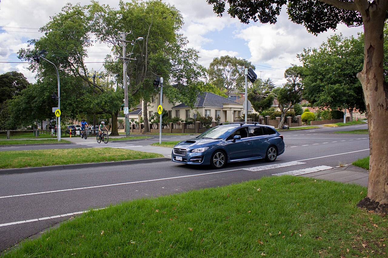 Zebra crossing for the Glass Creek Trail across a suburban road