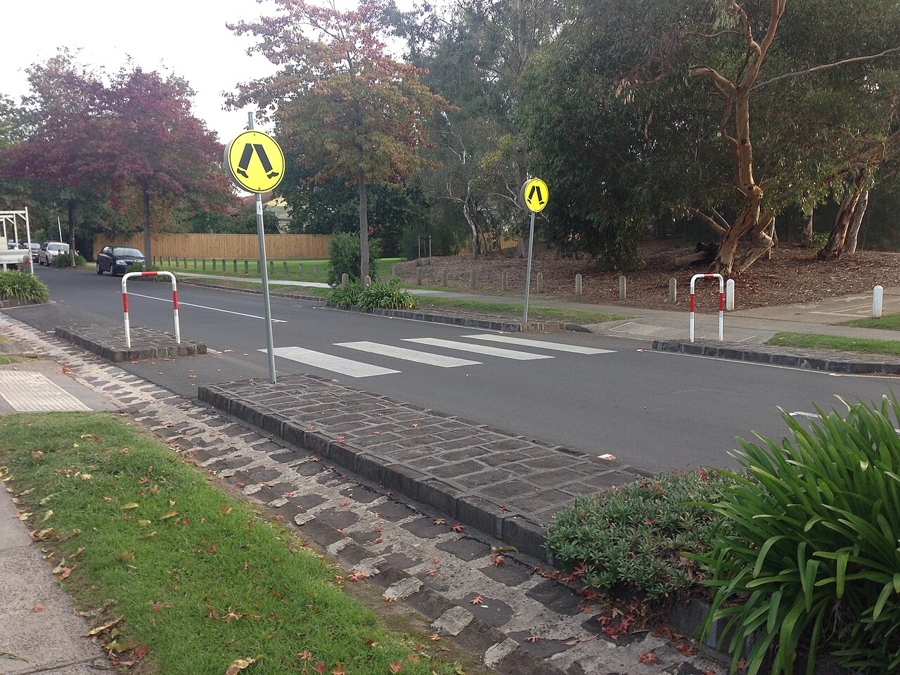 Zebra crossing on the Outer Circle Trail on a tree-lined street