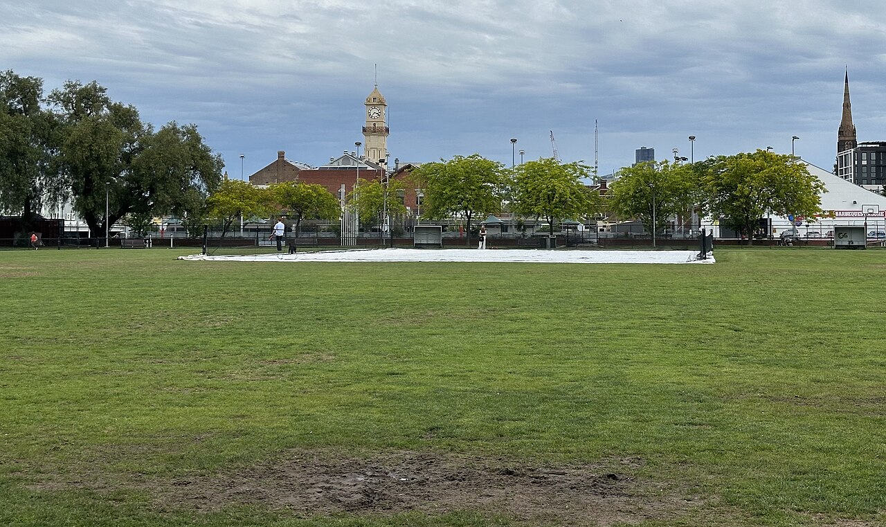 Citizens Park oval in Richmond with the Richmond Town Hall tower behind the trees
